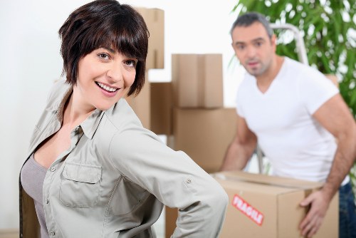 Experienced movers handling items with care during a move